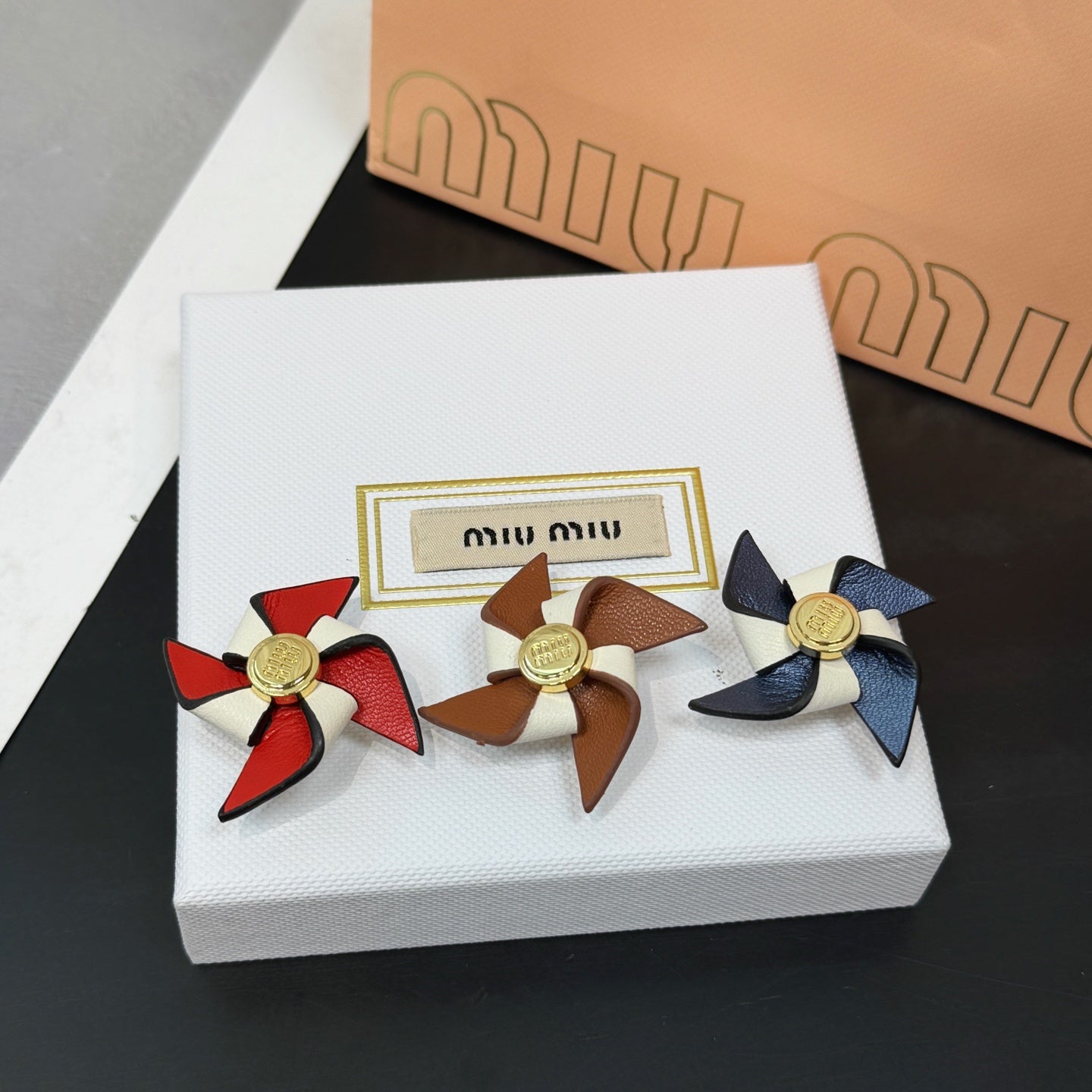 Leather pinwheel brooch